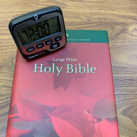Bible and stopwatch cropped